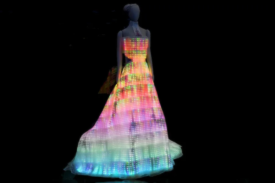 The full Galaxy Dress glowing with multicoloured light against black