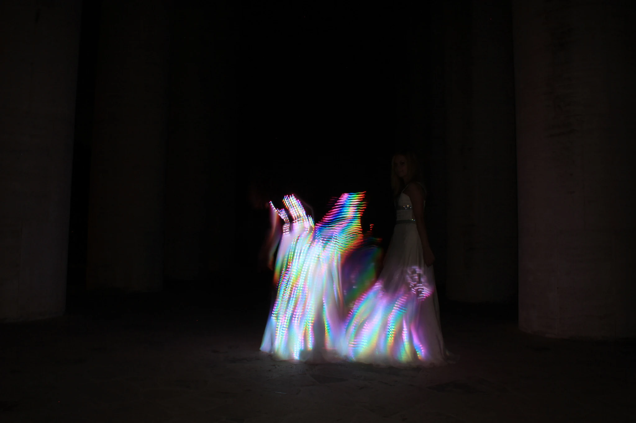 Aurora Dress glowing in rainbow light