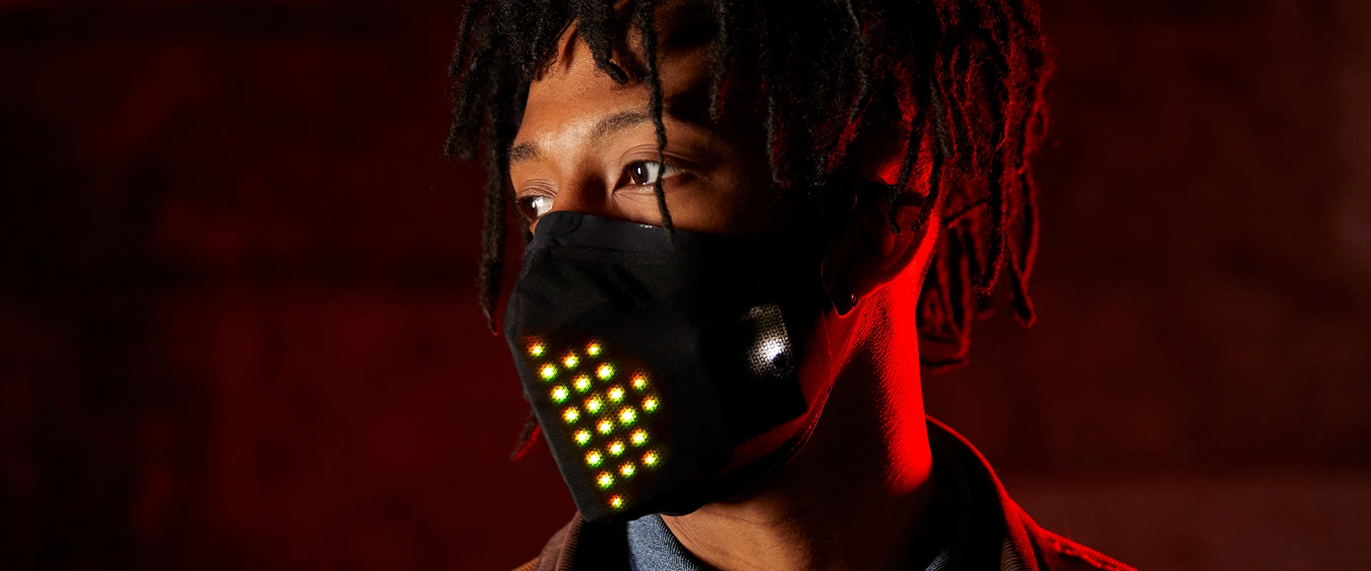 Portrait wearing the illuminated CuteCircuit mask for Mastercard and the BRIT Awards
