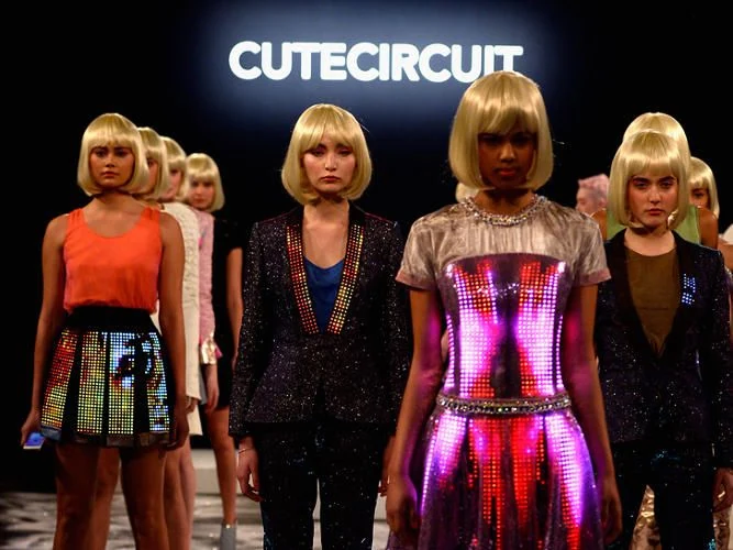 Models wearing CuteCircuit designs at the New York Fashion Week finale