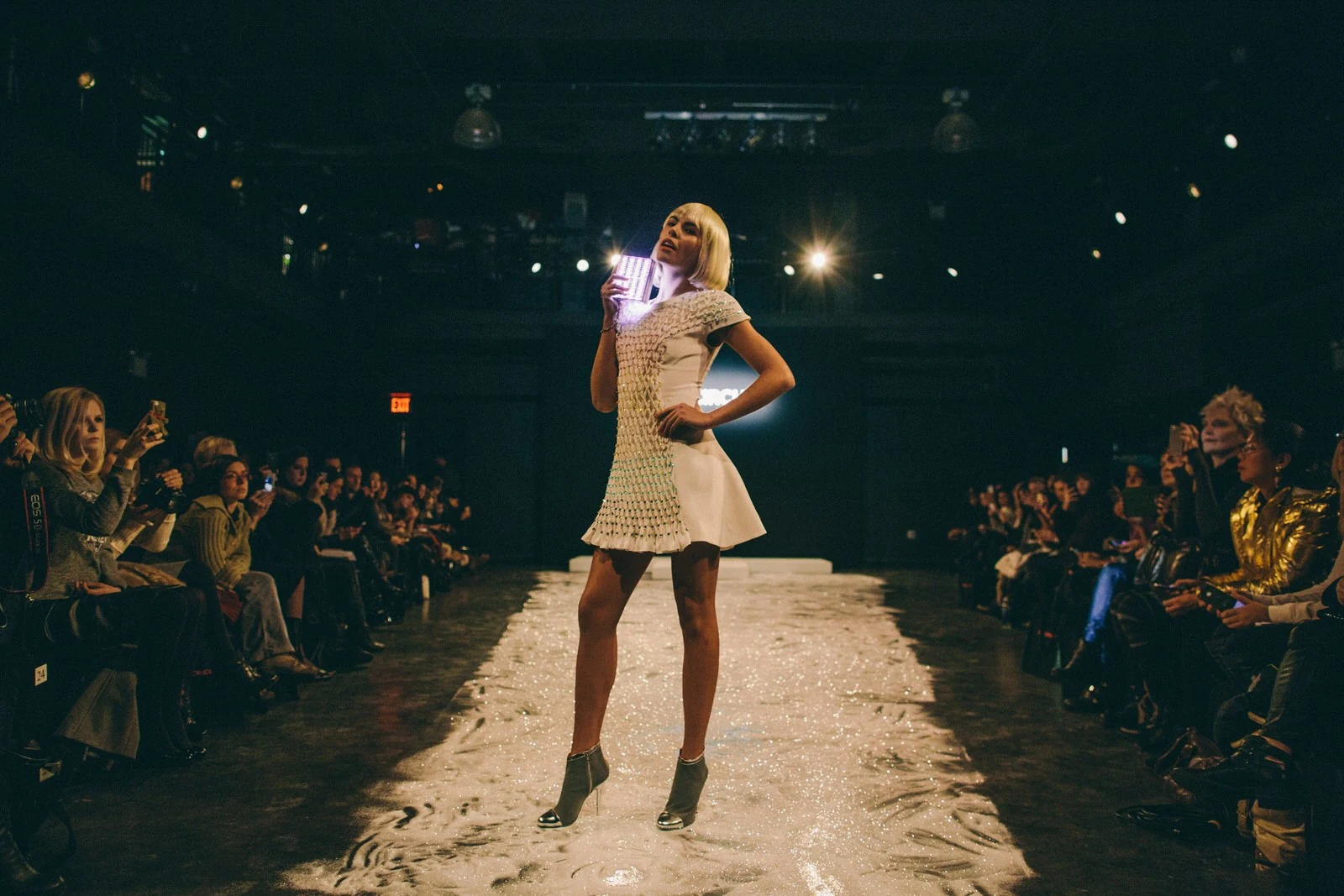 Model carrying the illuminated Mirror Handbag on the CuteCircuit New York runway