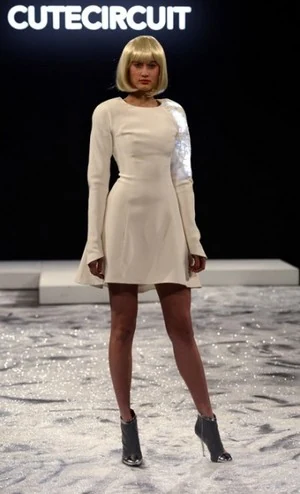 Model wearing a white CuteCircuit dress on the New York runway