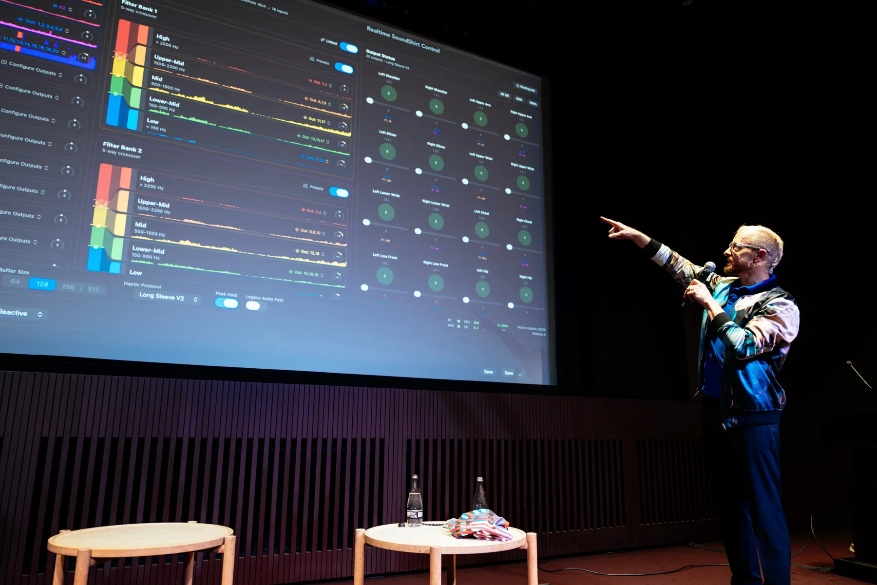 Ryan Genz pointing to the Q Pro interface during the CuteCircuit presentation at Tate Modern